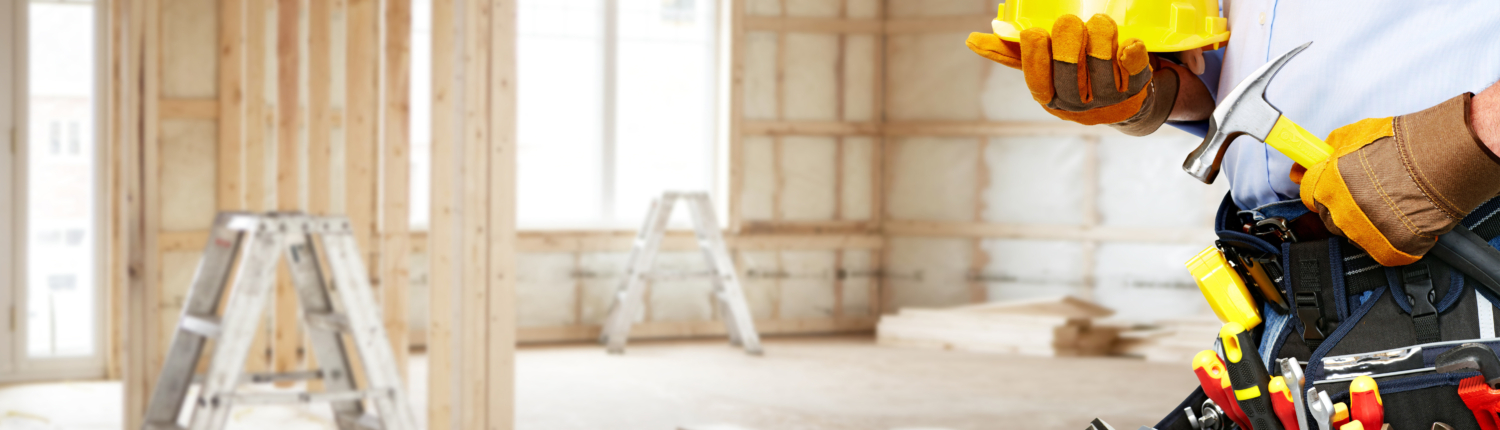 Builder,Handyman,With,Construction,Tools.,House,Renovation,Background.