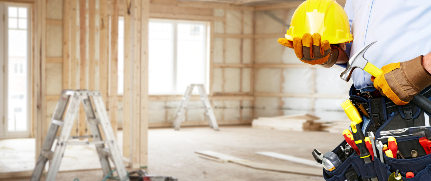 Builder,Handyman,With,Construction,Tools.,House,Renovation,Background.